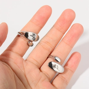 Silver stainless steel open ring with engraved tulip flower patterns on oval plates