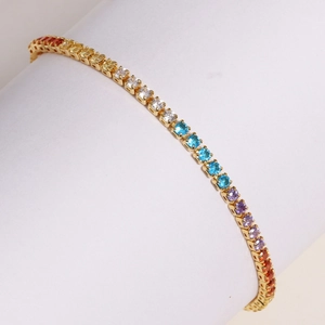 Rainbow gradient tennis bracelet with gold base and round cut zircon stones in main view