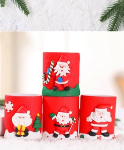 Close-up of festive red silicone Christmas Santa and snowman embossed pen holders