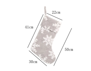 Grey plush Christmas stocking with snowflake patterns and detailed size measurements