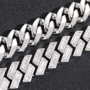 Macro detail of 20mm Cuban link chain featuring baguette and round-cut cubic zirconia