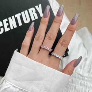 Detail of elegant S925 sterling silver rings with pink and clear zircon gemstones on hand