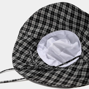 Stylish black and white checkered wide brim sun hat for women with adjustable chin strap