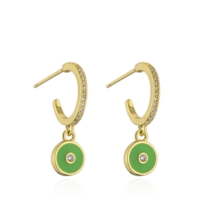 Detailed shot of 18K gold plated C-shaped earrings with green enamel zircon eye pendants
