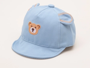 Detail of light blue baby cotton cap featuring 3D ears and cartoon bear embroidery