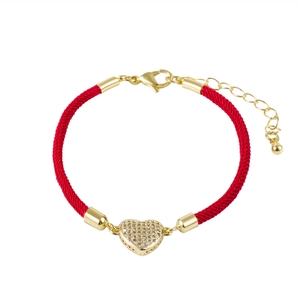 Red braided rope bracelet with a gold heart pendant pavé set with sparkling zircons