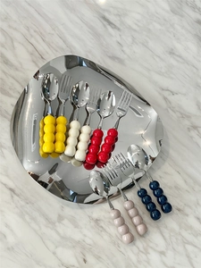 Detail of 304 stainless steel dessert forks and spoons with colorful bubble bead handles