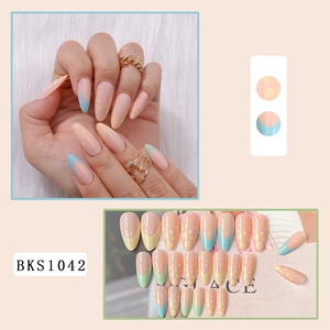 Detail of long almond press-on nails with macaron French tips and floral patterns