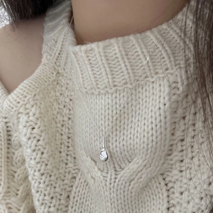 Polished 925 sterling silver teardrop pendant necklace on a delicate chain worn by model