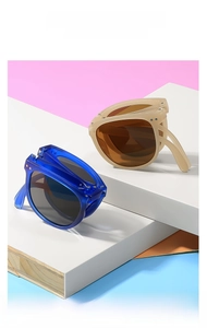 Lunettes de soleil pliables pour enfants en bleu et beige avec verres ronds