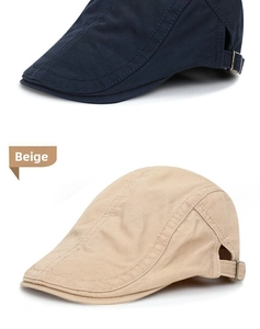 Detail of adjustable metal buckles and stitching on navy and beige flat caps