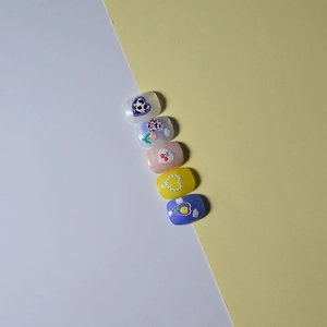 Detailed 5D relief nail stickers featuring cow print, heart, and tulip patterns
