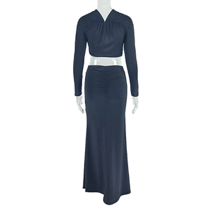 Detail of navy blue two-piece set featuring ruched long skirt and cropped top back view