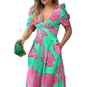 Women's V-neck green romper with pink palm leaf print and stylish puff sleeves