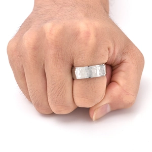 Detailed view of hammered silver titanium steel ring with unique textured finish for men