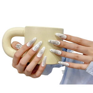 Handmade almond press-on nails with silver rabbit art and sparkling 3D rhinestones