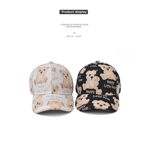 Detail of grey and black baseball caps with cartoon bear print and Happy Little Bear text
