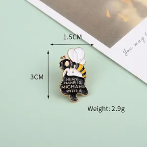 Cute cartoon honey bee enamel brooch with Michael text in yellow and black alloy