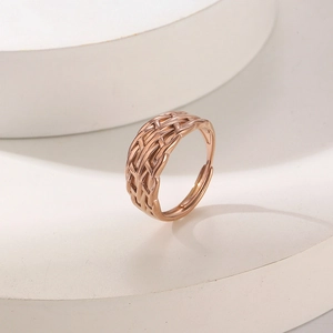 Detailed view of rose gold braided texture on an adjustable unisex stainless steel ring