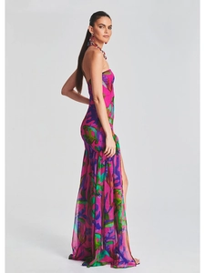 Close-up of strapless maxi dress with vibrant abstract print and side high slit detail