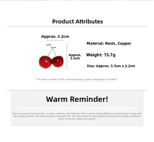 Detail view of red cherry earrings with gold stems and silver needle material specs