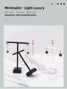 Three-piece acrylic and plastic T-shape earring display stands with marble backdrop