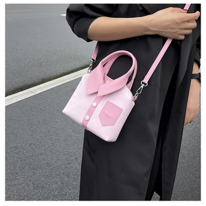 Pink shirt-design leather crossbody bag with collar and button details on black coat