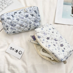 Quilted cartoon pencil cases with star and ocean patterns showing large zipper storage