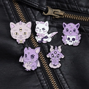 Detailed macro view of five purple gothic cat enamel pins on a black leather jacket