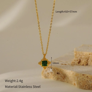 Macro detail of gold stainless steel necklace with green turquoise pendant and size specs