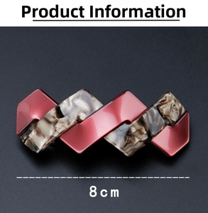 Detail view of 8cm geometric hair clip with red and marble pattern resin finish