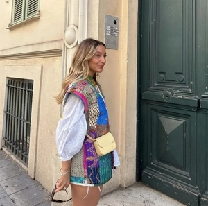 Women sleeveless patchwork printed cotton vest styled with white shirt and yellow crossbody bag