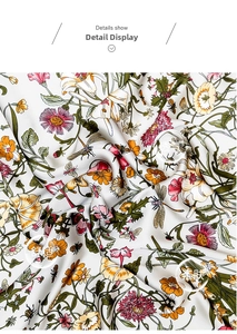 Macro detail of breathable silk scarf featuring floral prints and garden elements