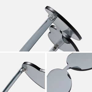 Frameless heart-shaped grey sunglasses with durable metal hinges and transparent resin frame
