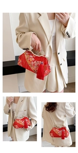 Detail of red Chinese style shell bag with gold floral embroidery and pearl strap