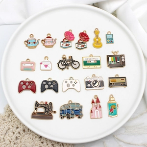 Macro view of eighteen vintage enamel alloy charms including camera and record player