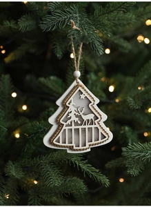 Detail of wooden Christmas tree ornament with elk carving and warm LED lights
