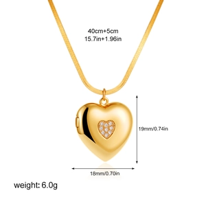 Macro view of gold heart pendant showing dimensions and shell-patterned metal texture