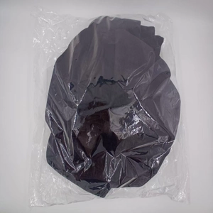 Close-up of a large decorative fabric butterfly folded in clear protective packaging