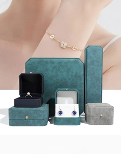 Close-up of premium octagonal PU leather jewelry boxes with pearl ring and velvet lining