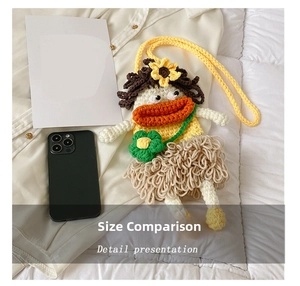 Macro view of handmade crochet cartoon bag showing knitted sunflower and grass skirt details