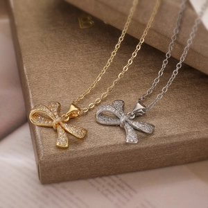 Elegant 18K gold and silver plated bow pendant necklaces with zircon crystals for women