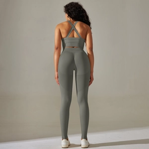 Detail of cross-back sports bra and seamless high-waist leggings in olive green set