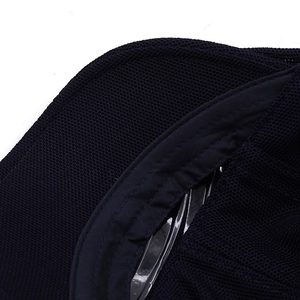 Detailed close-up of breathable mesh fabric and sweatband on a navy summer cap