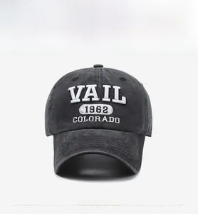 Detail of vintage gray washed denim baseball cap with white VAIL 1962 3D embroidery