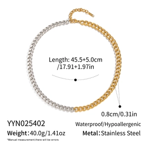 Macro shot of two-tone stainless steel chain links with waterproof S.Steel stamp detail