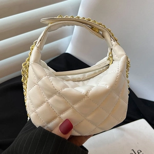 Mini white quilted crossbody bag with elegant gold chain handle for women stylish casual look