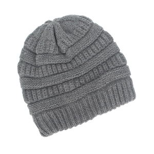 Close-up of medium grey knitted beanie featuring coarse knit texture and ribbed cuff detail