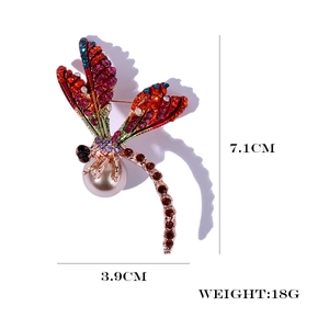 Detail showing colorful rhinestone dragonfly brooch dimensions of 7.1cm and 3.9cm