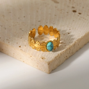 Minimalist 18K gold stainless steel wavy ring with an oval turquoise stone on stone